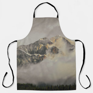 SNOW COVERED MOUNTAIN UNDER CLOUDY SKY DURING DAYT APRON