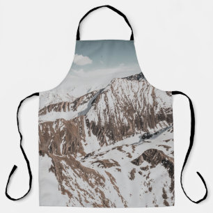 SNOW COVERED MOUNTAIN UNDER WHITE CLOUDS DURING DA APRON