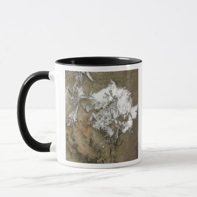 Snow covers the Rocky Mountains in United State Mug (Left)