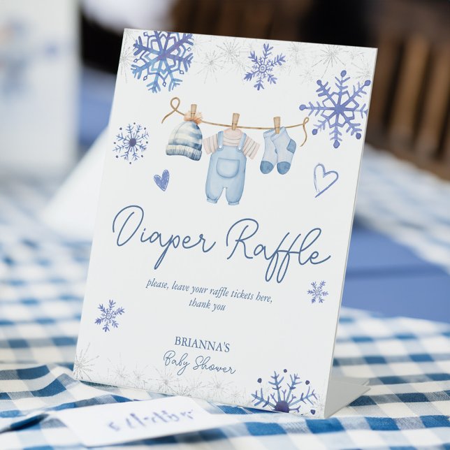 Snow in love winter baby shower diaper raffle pedestal sign (Snow in love blue snowflakes clothes line winter baby shower diaper raffle pedestal table sign )