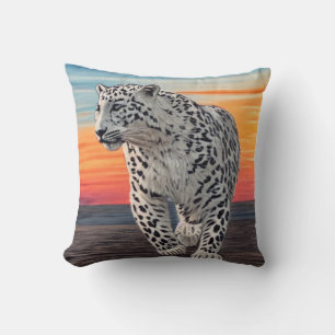 Snow Leopard Walking on the Beach During a Sunset Cushion