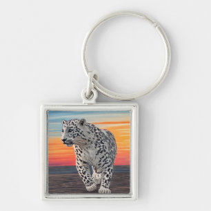 Snow Leopard Walking on the Beach During a Sunset Key Ring