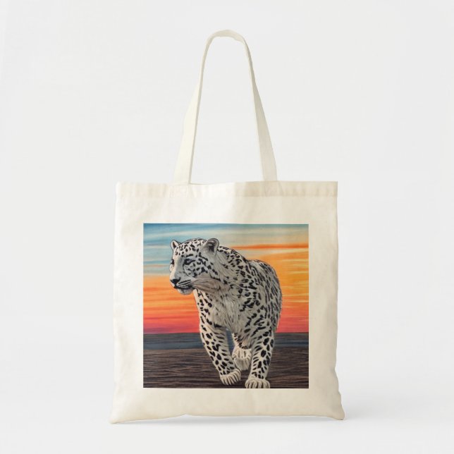 Snow Leopard Walking on the Beach During a Sunset Tote Bag (Front)