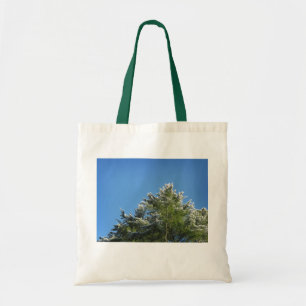 Snow-tipped Pine Tree on Blue Sky Tote Bag