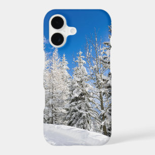 Snow trees under a clear blue sky