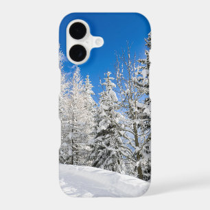 Snow trees under a clear blue sky