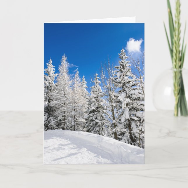 Snow trees under a clear blue sky greeting card (Front)
