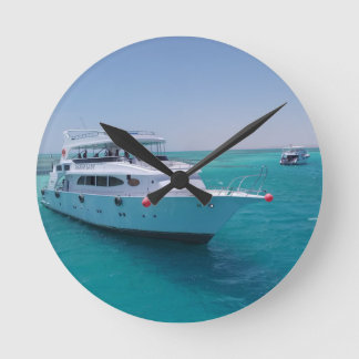 Snow-white yacht near the White Island in Red Sea Round Clock