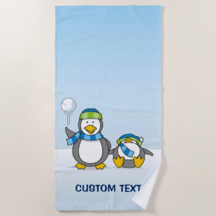 Snowballing penguins beach towel