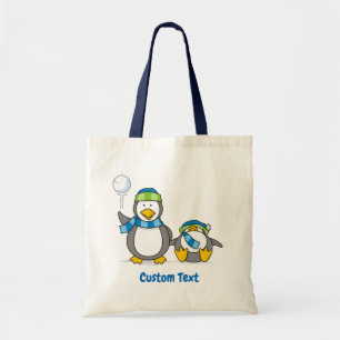 Snowballing penguins tote bag