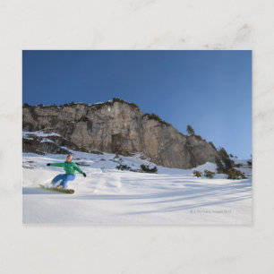 Snowboarder free riding postcard