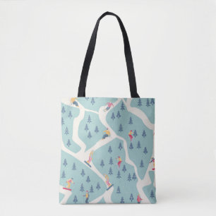 Snowboarders and skiers ride in the ski resort. Pe Tote Bag