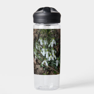 Snowdrops are the first flowers of spring  water bottle