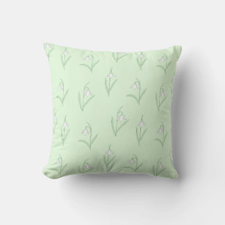 Snowdrops on green background cushion