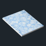 Snowfall on Blue Notepad<br><div class="desc">5.5” x 6” notepad with an image of pretty snowflakes on blue. See matching notebook. See the entire Hanukkah Notepad collection under the OFFICE category in the HOLIDAYS section.</div>