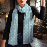 Snowflake Blue and White Christmas Scarf<br><div class="desc">Embrace the winter season with this elegant blue and white Christmas scarf featuring a delicate snowflake pattern. The timeless blue background and contrasting white snowflakes create a chic and versatile look that complements any holiday outfit. Made from lightweight chiffon, this scarf adds a touch of sophistication to your winter wardrobe...</div>