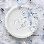 Snowflake Blue Bow Winter Bridal Shower Paper Plat Paper Plate<br><div class="desc">Add a touch of frosty elegance to your table setting with these winter bridal shower paper plates. Designed with delicate snowflakes and a chic blue bow,  they’re perfect for serving treats while keeping your celebration stylish and seasonal.</div>