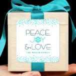 Snowflake Peace Joy Love Modern Typography Holiday Square Sticker<br><div class="desc">“Peace, joy & love.” A fun, playful, dark teal blue and turquoise snowflake illustration and modern typography on a white background help you usher in the holiday season. Additional turquoise confetti dots frame the sticker. Feel the warmth and joy of the holidays whenever you use this stunning, graphic, personalised holiday...</div>