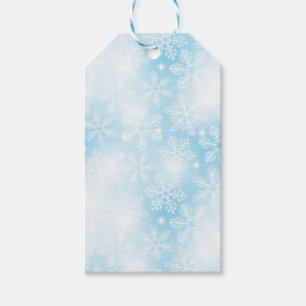 Snowflakes and lights on blue gift tags