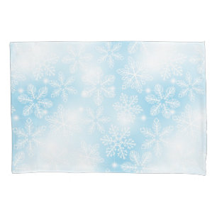 Snowflakes and lights on blue pillowcase