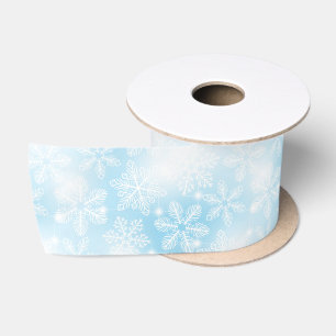 Snowflakes and lights on blue satin ribbon