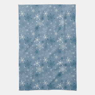 Snowflakes on a blue background tea towel