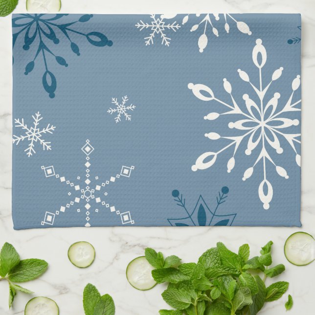 Snowflakes on a blue background tea towel (Folded)