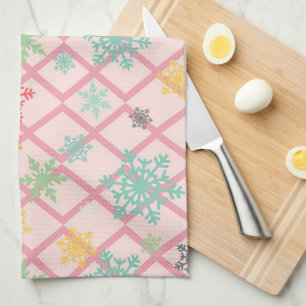Snowflakes on a pink background with trellis tea towel