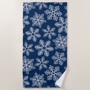 Snowflakes on dark blue beach towel