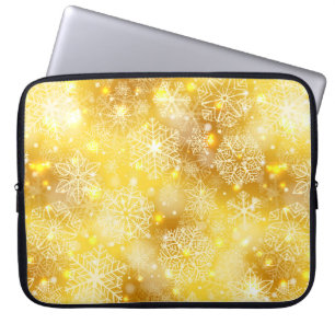 Snowflakes on golden laptop sleeve