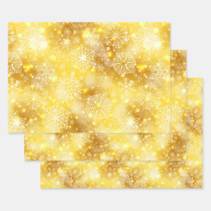 Snowflakes on golden wrapping paper sheet