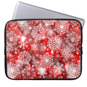 Snowflakes on red laptop sleeve