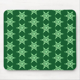 Snowflakes, pale green crystals on dark green mouse mat