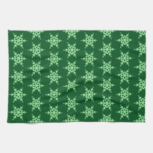 Snowflakes, pale green crystals on dark green tea towel