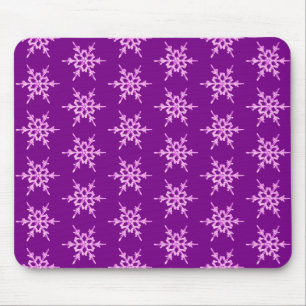 Snowflakes, pale orchid crystals on purple mouse mat