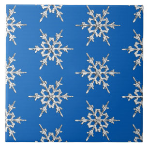 Snowflakes, silver crystals on cobalt blue tile