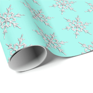 Snowflakes, silver crystals on pale aqua wrapping paper