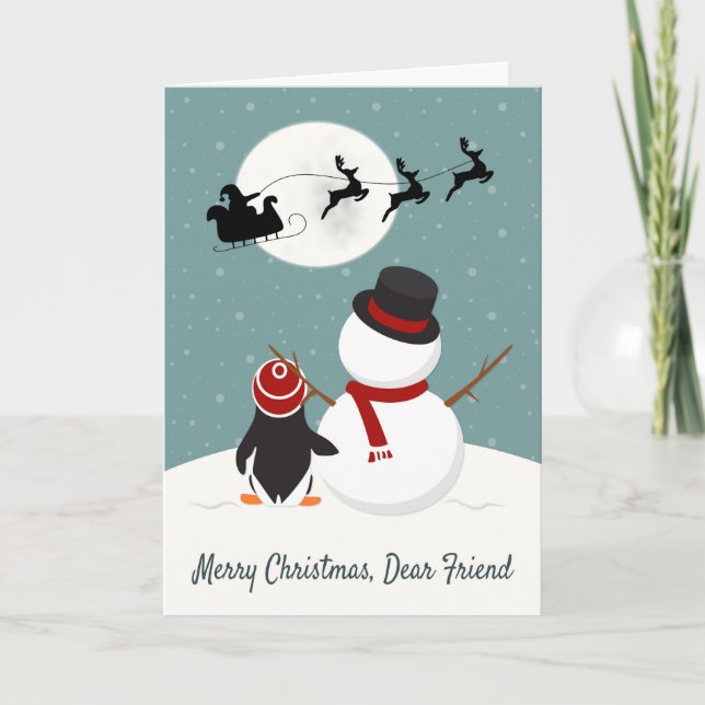 Snowman and Penguin Watch Santa’s Sleigh Holiday Card (Front)