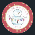 Snowman and String Lights Classic Round Sticker<br><div class="desc">Festive red and gold "made especially for you " sticker featuring my lighthearted watercolor snowman holding a string of colourful holiday lights.  Personalise text as preferred.</div>