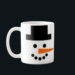 Snowman Face Winter Holiday Coffee Mug<br><div class="desc">This fun and whimsical mug has a snowman's face on a white background! Coal eyes and mouth, a black top hat, and an orange carrot nose that wraps around sideways will brighten your day. Perfect for winter holidays, or all season long!</div>
