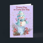Snowman Hugs Christmas Cards<br><div class="desc">Snowman hugs Christmas card with a cute snowman standing on a container with decorations surrounding it.  The words on the inside can be changed.</div>