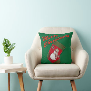 Snowman on Christmas Stocking Over Green Cushion