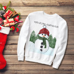 Snowman Red Beanie Ugly Christmas Black Typography Sweatshirt<br><div class="desc">Super cute and joyful snowman with a red beanie and green scarf; standing before a pine trees forrest whist snowing. Custom Merry Christmas and Happy New Year black typography, make this sweater a fantastic outfit for your Ugly Christmas party. Make it funny, make it unique. This illustration was inspired by...</div>