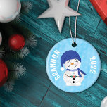Snowman's Cocoa Delight Christmas Tree Ceramic Tree Decoration<br><div class="desc">Elevate your holiday spirit with our charming "Snowman's Cocoa Delight" Christmas Tree Ornament. This delightful ornament is the perfect addition to your festive decor, featuring a heartwarming and playful design that captures the essence of the Christmas season. On the front of the ornament, a cheerful snowman enjoys a cup of...</div>
