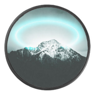 Snowy mountain mysterious blue neon light hockey puck
