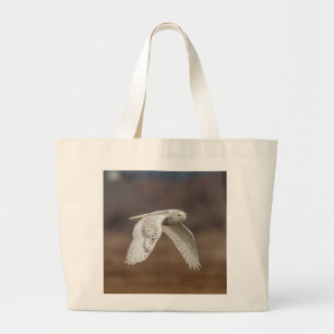 Snowy owl in flight large tote bag