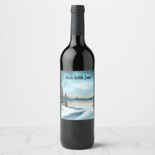 Snowy pine trees near a lake wine label