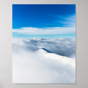 Snowy winter mountain wrapped in clouds poster