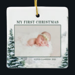 Snowy Woodland Baby's First Christmas Photo Cerami Ceramic Ornament<br><div class="desc">Merry Christmas! Add a festive winter accent to your Christmas tree with this custom Christmas baby photo ornament. It features watercolor snowy winter woodland. Personalize by adding photos, holiday greeting, year and family signature. Feature your favourite baby photo with this woodland Christmas photo ornament. This watercolor holiday photo ornament will...</div>