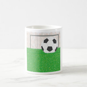 Soccer Ball and Goal Post on Green Grass Field Coffee Mug